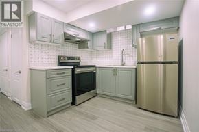 Milton apartment for rent - A kitchen with a stove top oven and a refrigerator.