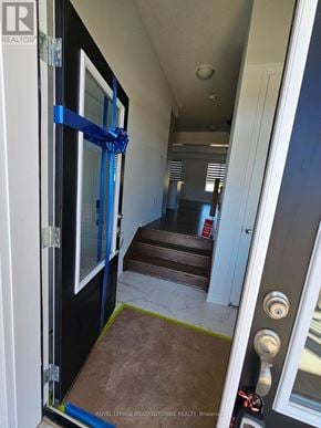 Kitchener apartment for rent - A hallway with a door on the left and a door on the right.