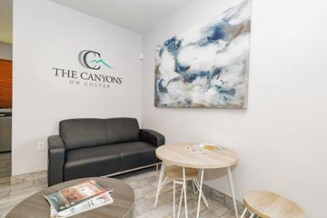 Glendale apartment for rent - A living room with a couch, a coffee table, and a painting on the wall.