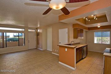 Tucson apartment for rent - A kitchen with a ceiling fan and tile flooring.