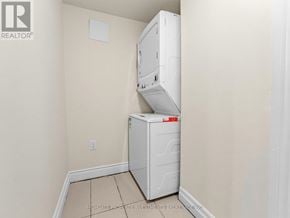 Brampton (Madoc) apartment for rent - A white refrigerator freezer is in a corner of a room with beige walls.