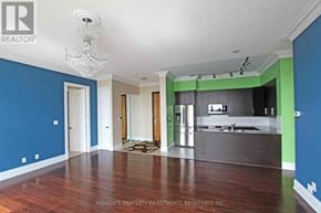 Markham (Unionville) condo for rent - A room with a chandelier and a dining table.