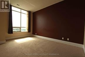 Markham (Unionville) condo for rent - A room with a window and a wall with a darker shade at the bottom.