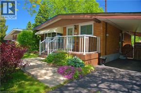 Hamilton apartment for rent - A house with a red brick exterior and a white porch.