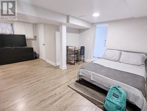 Toronto (Palmerston-Little Italy) apartment for rent - A bedroom with a bed, a desk, and a chair.