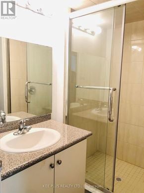 Toronto (South Riverdale) apartment for rent - A bathroom with a sink, mirror, and shower.