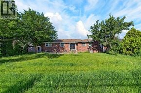 Windsor apartment for rent - A house with a lawn in front of it.