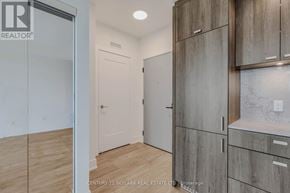 Toronto (Dovercourt-Wallace Emerson-Junction) condo for rent - A room with wooden floors and a white door.