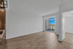 Toronto (Dovercourt-Wallace Emerson-Junction) condo for rent - A spacious room with wooden flooring and a large window.