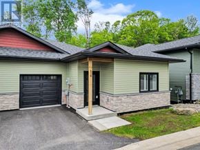 Huntsville (Brunel) apartment for rent - A house with a red roof and a garage door.