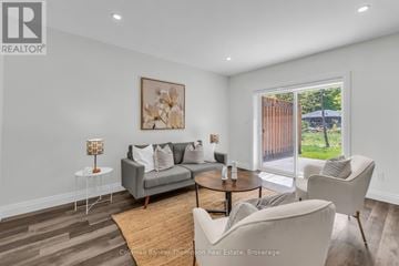Huntsville (Brunel) apartment for rent - A living room with a grey couch, a coffee table, and a painting on the wall.