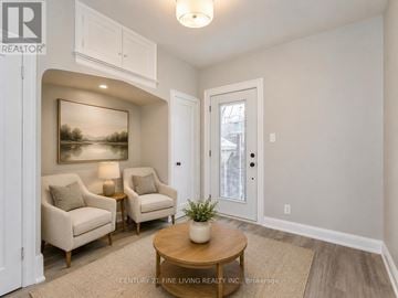 Toronto (Humewood-Cedarvale) apartment for rent - A living room with a painting on the wall and two chairs.