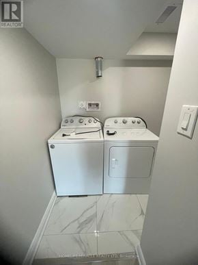 Barrie apartment for rent - A white washer and dryer in a small room.