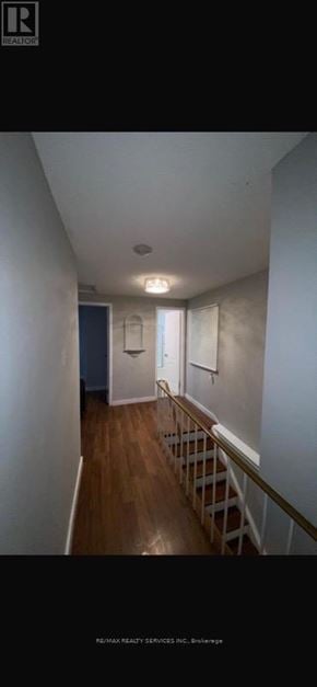 Brampton (Central Park) apartment for rent - A hallway with a wooden floor and white walls.