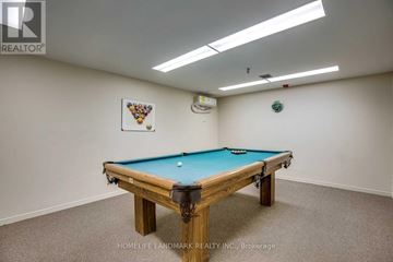 Mississauga (City Centre) condo for rent - A pool table in a room with a light colored wall.