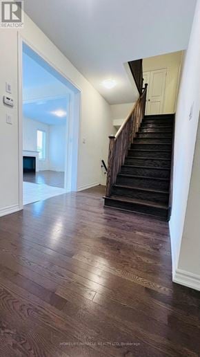 Brampton (Credit Valley) apartment for rent - A hallway with a staircase and a doorway leading to another room.