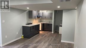 Kitchener apartment for rent - A kitchen with a large island and modern appliances.