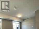 Kitchener townhouse for rent - A realtor logo is on the wall.
