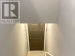 Kitchener townhouse for rent - A hallway with a door at the end.