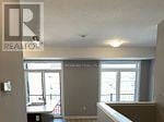 Kitchener townhouse for rent - A room with a Realty sign on the wall.