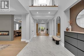 Oakville (Wo West) apartment for rent - A spacious hallway with a marble floor and a bench.