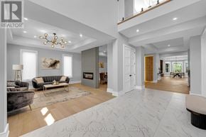 Oakville (Wo West) apartment for rent - A modern living room with a fireplace and a large painting on the wall.