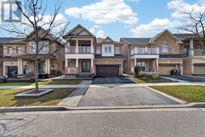 Brampton (Credit Valley) apartment for rent - A row of houses with a sign that says Century 21 Green Realty, Inc. Brokerage.