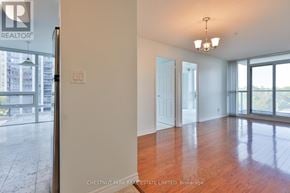 Toronto (Willowdale East) condo for rent - A room with a wooden floor and a sliding glass door leading to a balcony.
