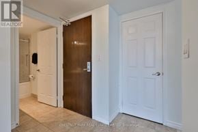 Toronto (Willowdale East) condo for rent - A hallway with a brown door and a white door.