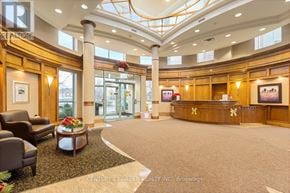 Mississauga (Central Erin Mills) condo for rent - A reception area with a desk and chairs.