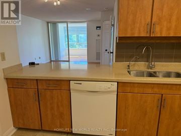 Toronto (Newtonbrook West) condo for rent - A kitchen with wooden cabinets and a white dishwasher.