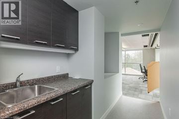 Waterloo condo for rent - A kitchen with a sink and cabinets.