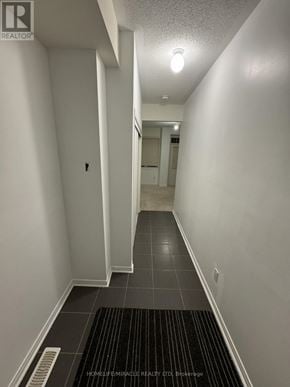 Ajax (Central) townhouse for rent - A hallway with a black and white striped rug on the floor.