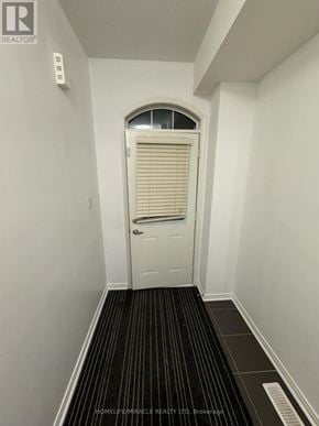 Ajax (Central) townhouse for rent - A hallway with a door and a window with blinds.