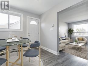 Cambridge fourplex for rent - A dining room with a glass table and chairs.