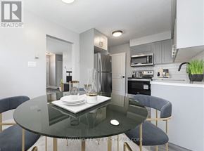 Cambridge fourplex for rent - A modern dining room with a glass table and chairs.