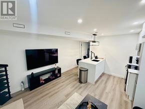 Toronto (Caledonia-Fairbank) apartment for rent - A modern living room with a flat screen TV mounted on the wall.