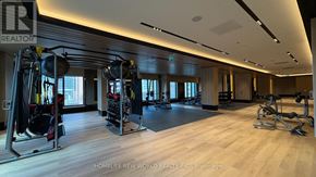 Toronto (Church-Yonge Corridor) condo for rent - A gym with a variety of equipment including a treadmill, weights, and a bench press.