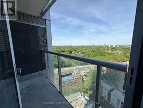 Toronto (North St. James Town) condo for rent - A balcony with a view of a cityscape.