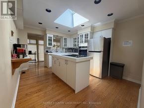 Ramara (Brechin) apartment for rent - A kitchen with a skylight and wooden floors.
