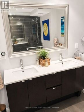 Toronto (Church-Yonge Corridor) condo for rent - A bathroom with a white countertop and brown cabinets.
