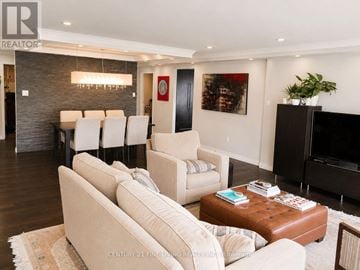 Toronto (Church-Yonge Corridor) condo for rent - A living room with a white couch and a brown coffee table.