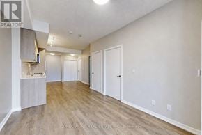Toronto (Henry Farm) condo for rent - A spacious room with wood flooring and white walls.