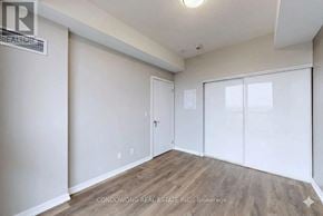 Toronto (Henry Farm) condo for rent - A room with a sliding door and a window.