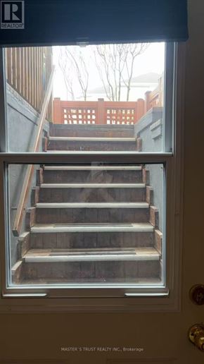Mississauga (Fairview) apartment for rent - A set of stairs is visible through a window.