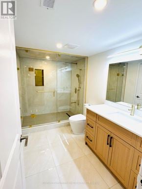 East Gwillimbury (Holland Landing) apartment for rent - A bathroom with a toilet, sink, and shower.