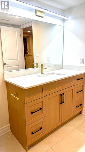East Gwillimbury (Holland Landing) apartment for rent - A bathroom with a sink and wooden cabinets.