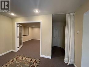 Coquitlam apartment for rent - A room with a carpet and a curtain.
