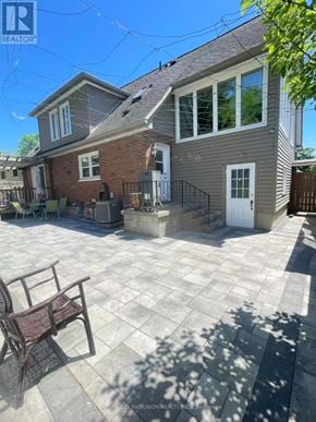 Oshawa (Lakeview) apartment for rent - A house with a patio and a chair.