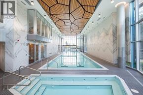 North Vancouver apartment for rent - A large indoor swimming pool with a wooden ceiling.